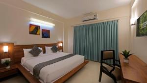 En eller flere senger på et rom på Ekaa Keys By Bestinn Leisure - Banglore