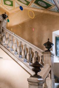 a spiral staircase with balls on the ceiling at Palacio de Aviles Affiliated By Melia in Avilés