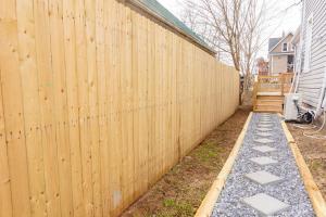 a fence next to a sidewalk next to a fence at Newly renovated home less than a mile from downtown Roanoke in Roanoke