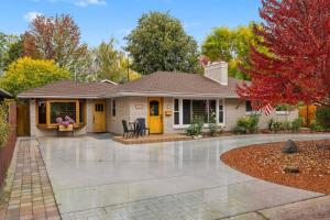 a house with yellow doors and a patio at Marshall Street Music Retreat in Boise