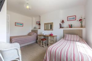 Tempat tidur dalam kamar di The Globe Inn