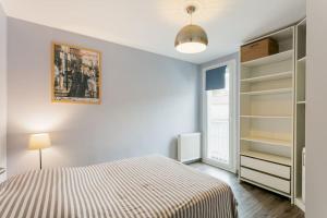 En eller flere senger på et rom på Appartement T4 Centre Ville Séte tout confort 3 chambres