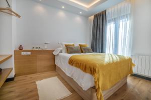 Posteľ alebo postele v izbe v ubytovaní Olivia Suites Apartments