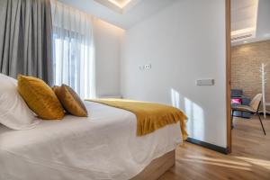 Posteľ alebo postele v izbe v ubytovaní Olivia Suites Apartments