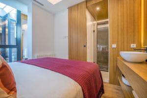 Posteľ alebo postele v izbe v ubytovaní Olivia Suites Apartments