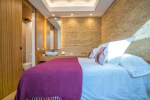 Posteľ alebo postele v izbe v ubytovaní Olivia Suites Apartments
