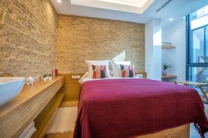 Posteľ alebo postele v izbe v ubytovaní Olivia Suites Apartments