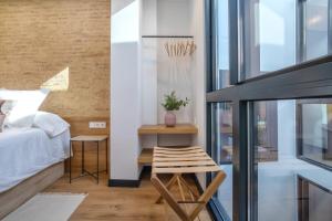 Posteľ alebo postele v izbe v ubytovaní Olivia Suites Apartments