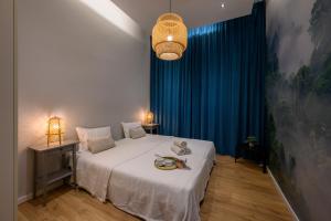 Łóżko lub łóżka w pokoju w obiekcie Rent-Apart City Center Lodz