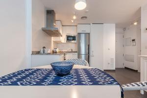 a kitchen with a table with a bowl on top of it at Apartamento La cala in L'Ametlla de Mar