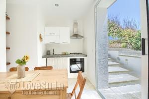 A kitchen or kitchenette at Casa con accesso diretto al mare by LoveSud