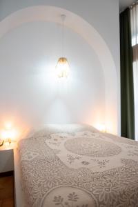 Ένα ή περισσότερα κρεβάτια σε δωμάτιο στο Casa d’arte Siciliana