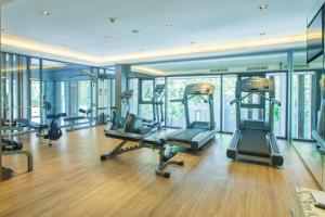 a gym with treadmills and ellipticals in a building at Hill & Valley Khaoyai by Nancy in Ban Huai Sok Noi