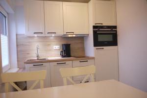 Kuchyň nebo kuchyňský kout v ubytování Melina + 7 fotografií