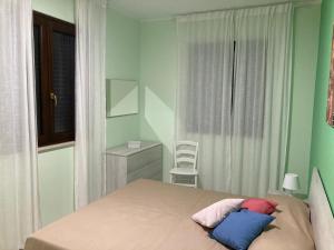 Postel nebo postele na pokoji v ubytování Villa Vimani