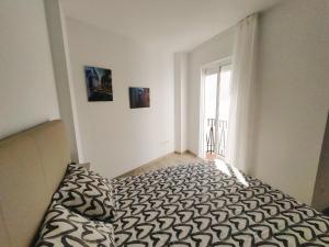 Postel nebo postele na pokoji v ubytování Nerja Sun Apartment Bronce A Centro