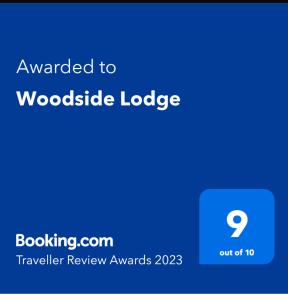 Sertifikat, penghargaan, tanda, atau dokumen yang dipajang di Woodside Lodge