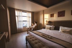 Tempat tidur dalam kamar di Lavie Residence and Spa