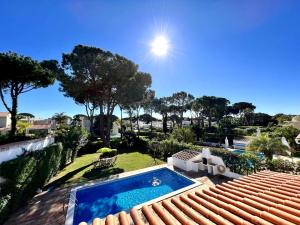 a villa with a swimming pool and a garden at Vilamoura Ocean Villa with Pool by Homing in Vilamoura