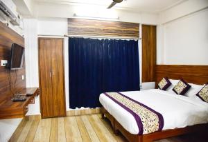 Voodi või voodid majutusasutuse Hotel Su Pinsa toas