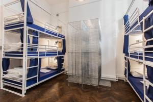 a room with bunk beds with blue and white shelves at The Bristol Wing in Bristol