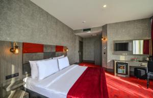 a hotel room with a large bed and a tv at A11 Hotel Atasehir in Istanbul +28 photos