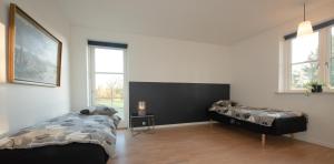Postel nebo postele na pokoji v ubytování Guesthouse Tradsborgvej