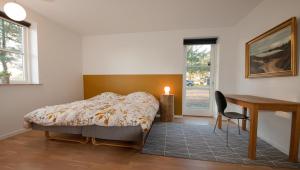 Postel nebo postele na pokoji v ubytování Guesthouse Tradsborgvej