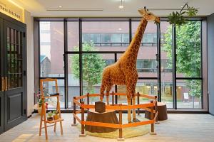 a giraffe statue on display in a room at La'gent Stay Sapporo Odori Hokkaido in Sapporo