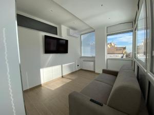 A television and/or entertainment centre at Casa Vacanze Alla Zisa