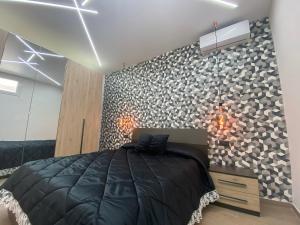 A bed or beds in a room at Casa Vacanze Alla Zisa