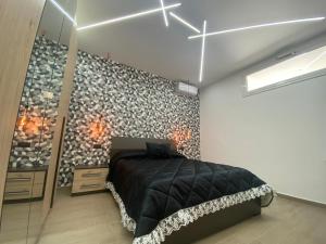 A bed or beds in a room at Casa Vacanze Alla Zisa
