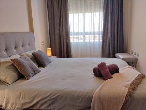 Postel nebo postele na pokoji v ubytování Comfortable Apartment in Excellent Location