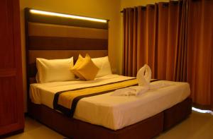 Beach Corridor Hotel & Spa with Free Airport shuttle客房内的一张或多张床位