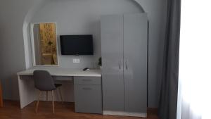 a white computer desk with a monitor and a chair at Laguna in Kiten +63 photos