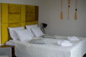 Łóżko lub łóżka w pokoju w obiekcie Ośrodek Wypoczynkowy & Restauracja & Hotel Półwysep Wądzyń