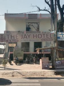 a building with a sign that reads the lax hotel at The Jay Hotel By WB Inn in Rāe Bareli