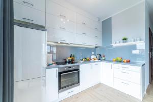 Kuchyňa alebo kuchynka v ubytovaní Apartament Jaskółcza 30