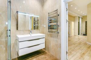 a bathroom with a sink and a shower at Luxury House in Nizami Street in Baku +50 photos