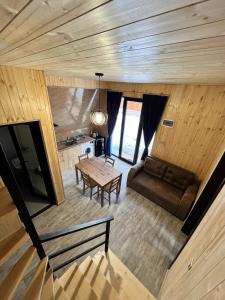 an overhead view of a living room with a table and a couch at Cottage Orcs in Borjomi