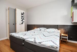 Posteľ alebo postele v izbe v ubytovaní Bocianie Gniazdo z ogródkiem i garażem
