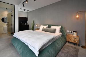 Postel nebo postele na pokoji v ubytování Y HOUSE SUITES