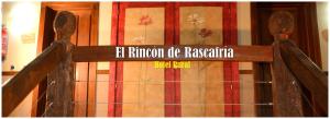 a wooden gate with a sign on top of it at El Rincón de Rascafría in Rascafría