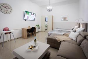Una televisión o centro de entretenimiento en Apartments Pia