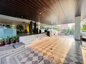 a lobby of a building with a checkered floor at Fortune Inn Promenade, Vadodara - Member ITC's Hotel Group in Vadodara