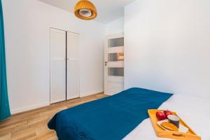 Кровать или кровати в номере Flatbook Apartamenty - Mikoszewo Wczasowa