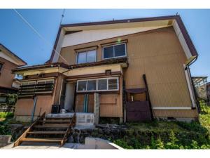 a house with the front of it at GuestHouse YADOYA - Vacation STAY 08450v in Tokamachi