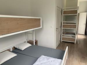 a bedroom with a bunk bed and a closet at Kasteel Boterlaerhof Antwerpen in Antwerp