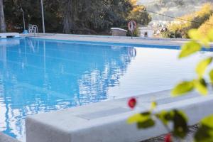 Bazén v ubytování Hotel Tugasa El Almendral nebo v jeho okolí