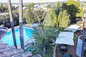 Bazén v ubytování Hotel Tugasa El Almendral nebo v jeho okolí